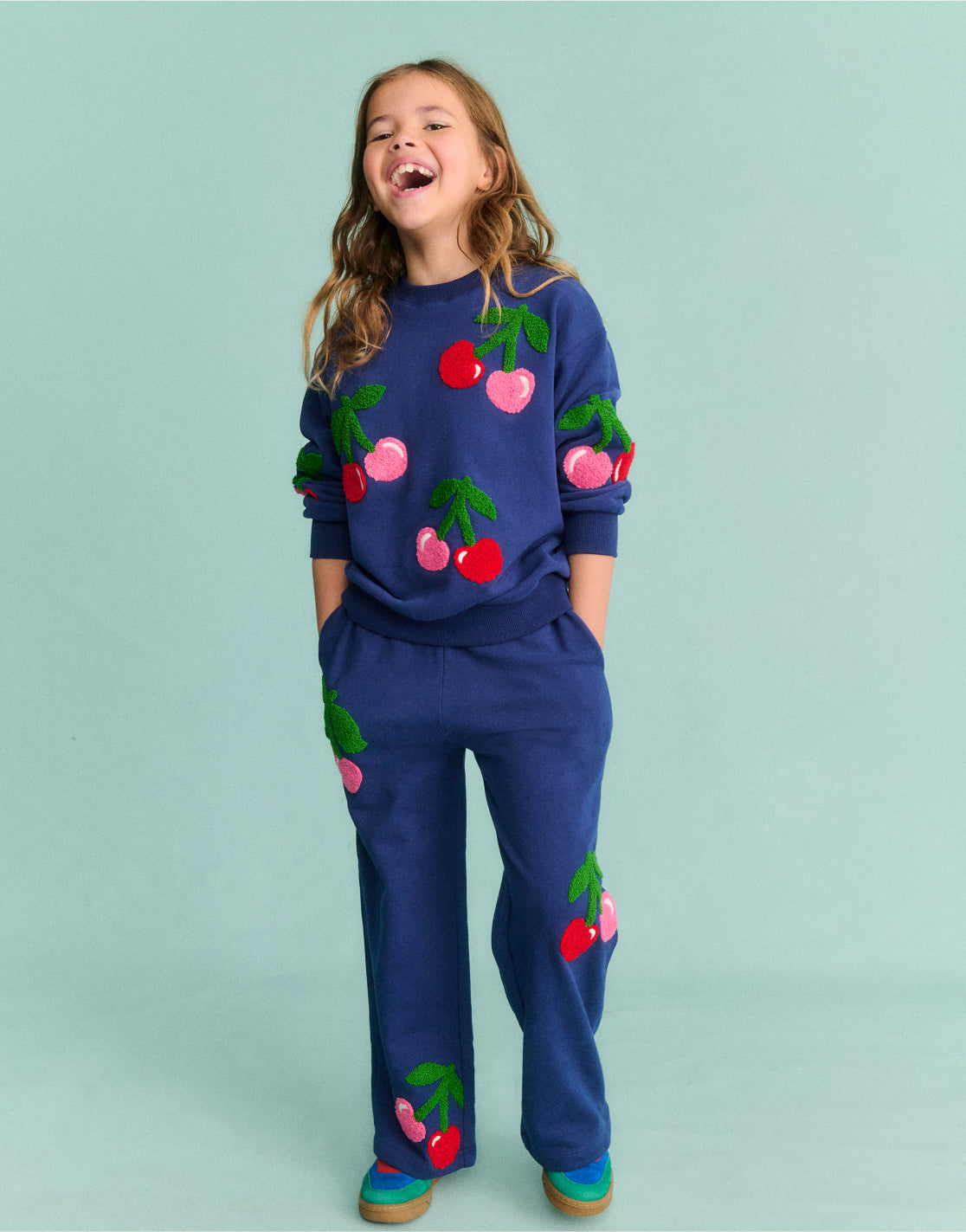 Girl wearing a Boden Jogger with Cherries Print