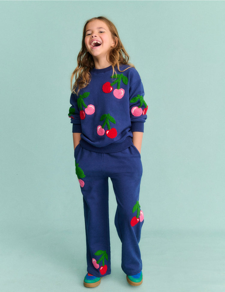 Girl wearing a Boden Jogger with Cherries Print