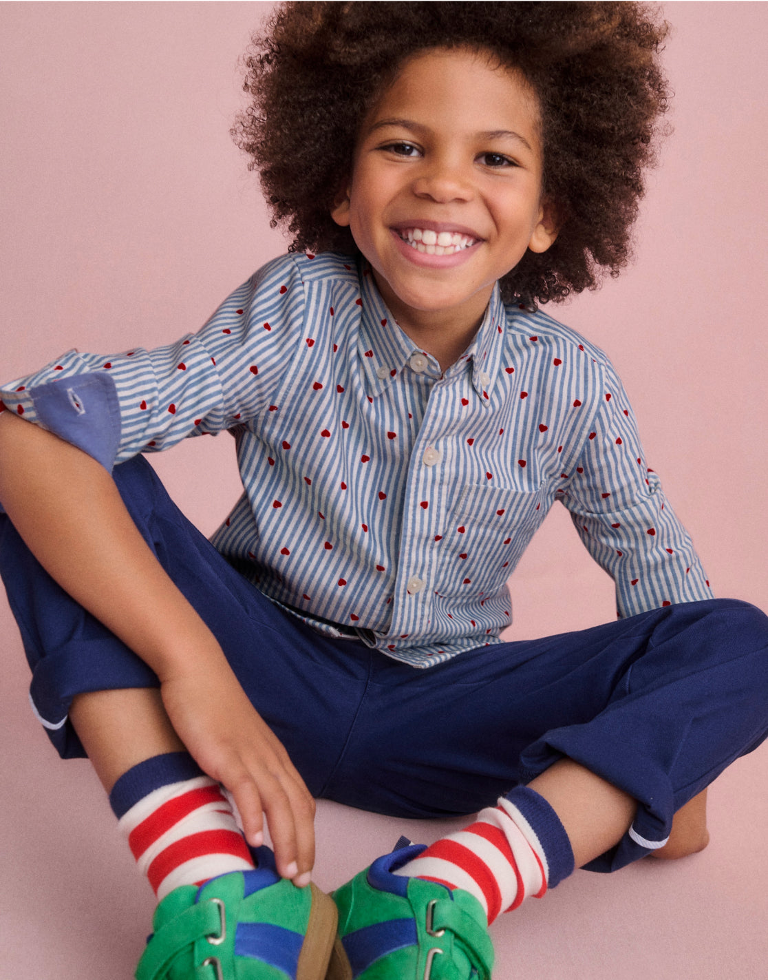 A Boy wearing a Shirt with Blue Seersucker Hearts 