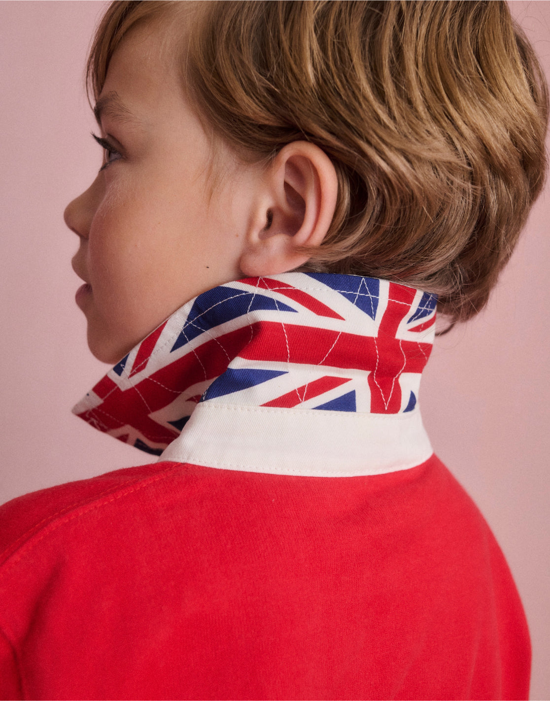 Boy wearing a Boden Classic Rugby Shirt